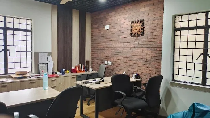 Modern Executive Office with Exposed Brick Accent Wall Corporate Office Layouts Desk and Decor 