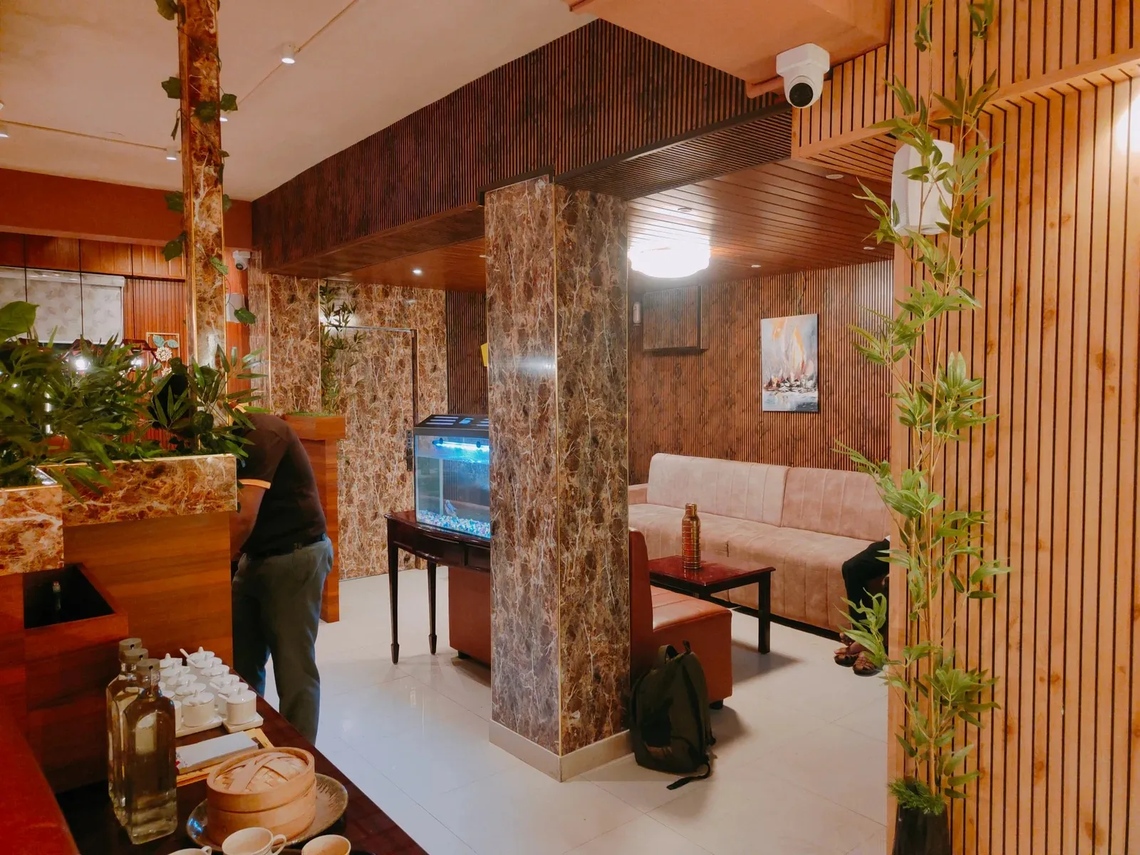 Oriental-Themed Restaurant Interior with Wooden Slat Wall & Booth Seating Luxury Hotel Lobby Design Desk and Decor 
