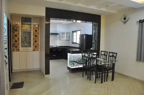 Open-Plan Kitchen with Dining Area & Pooja Unit Corner Modern Dining Room Designs Desk and Decor 