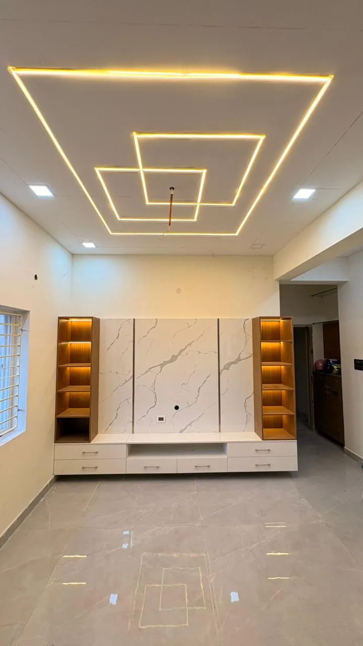 "Modern Luxury: Marble-Texture TV Backdrop with Symmetrical Illuminated Display Towers" | Interior Interior Design by Desk & Decor