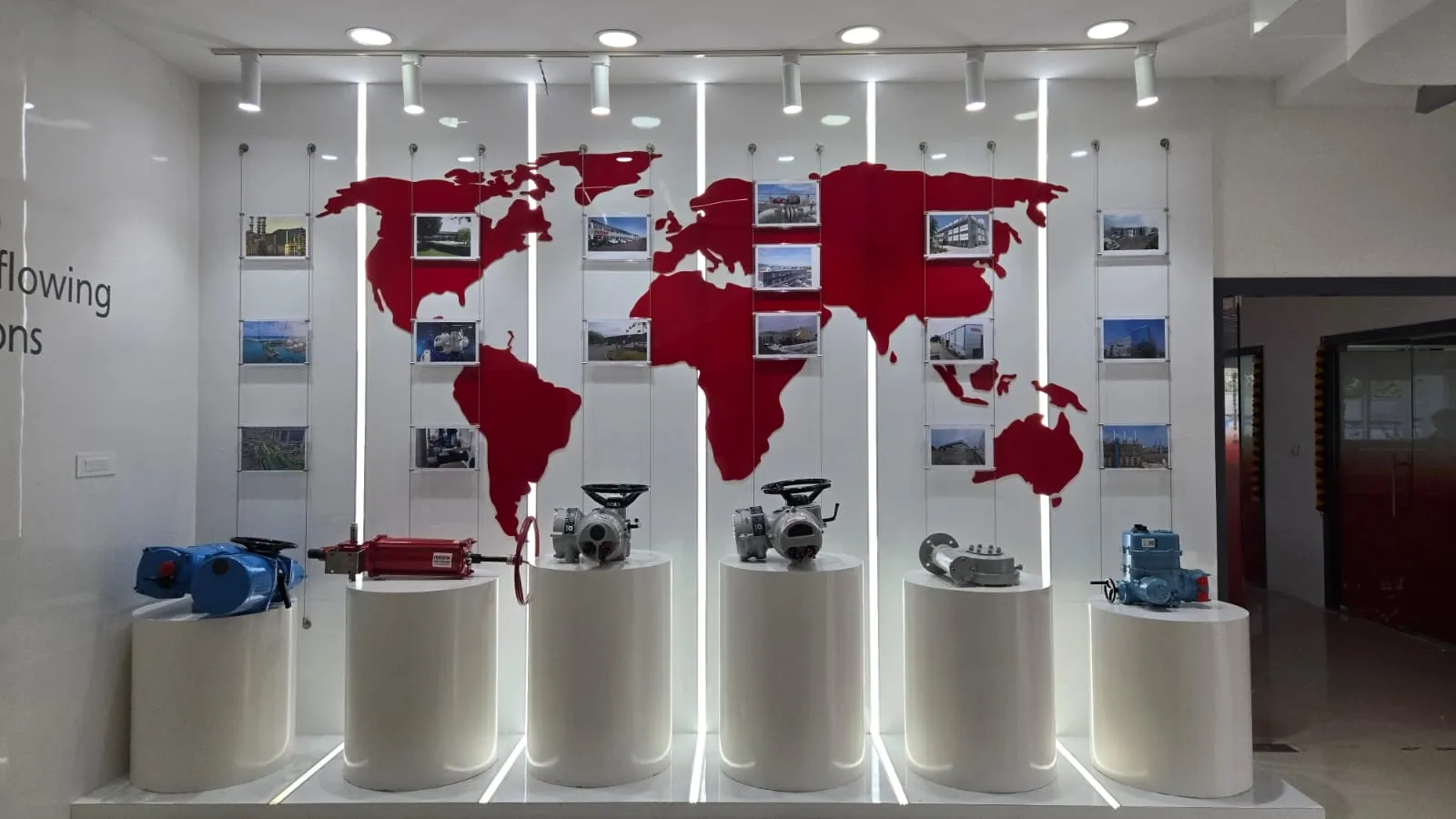 World Map Graphic with Suspended Photo Frames and Circular Pedestal Displays | Partitions & Panels Interior Design by Desk & Decor