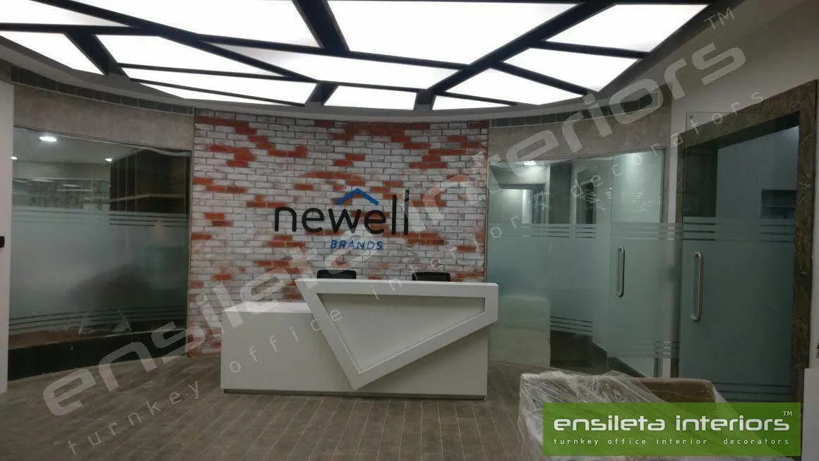 Rustic Brick-Accent Branding Wall with Geometric Minimalist Desk | Reception & Waiting Interior Design by Desk & Decor