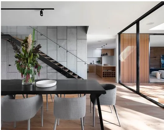 Dining Area with Open Staircase & Kitchen — Multi-Level Residence