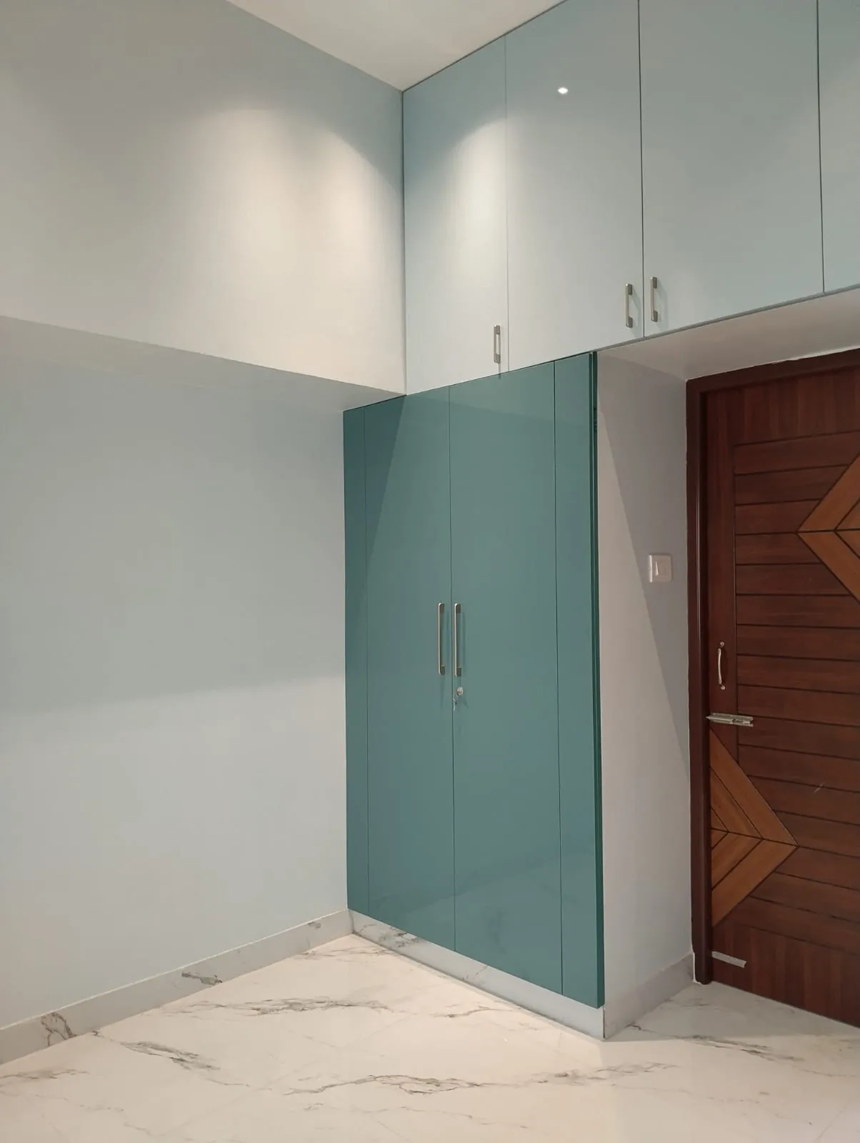 "Contemporary Minimalist: Floor-to-Ceiling Teal High-Gloss Hinged Wardrobe" | Wardrobes Interior Design by Desk & Decor