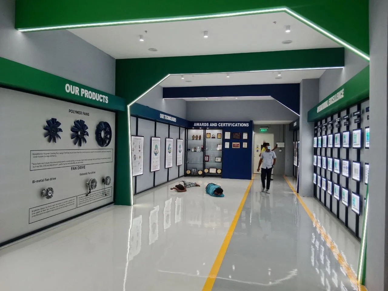 Industrial Product Display Gallery with Integrated 'Our Products' and 'Awards' Zoning | Showroom Interior Design by Desk & Decor