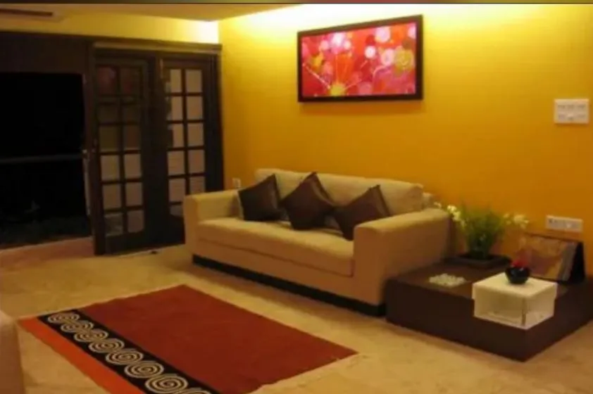 Living Room with Bold Yellow Accent Wall