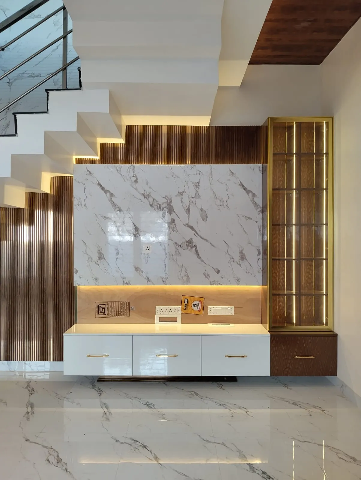 Under-Stair Entertainment Console with Backlit Marble and Fluted Accent Panels | TV Units Interior Design by Desk & Decor