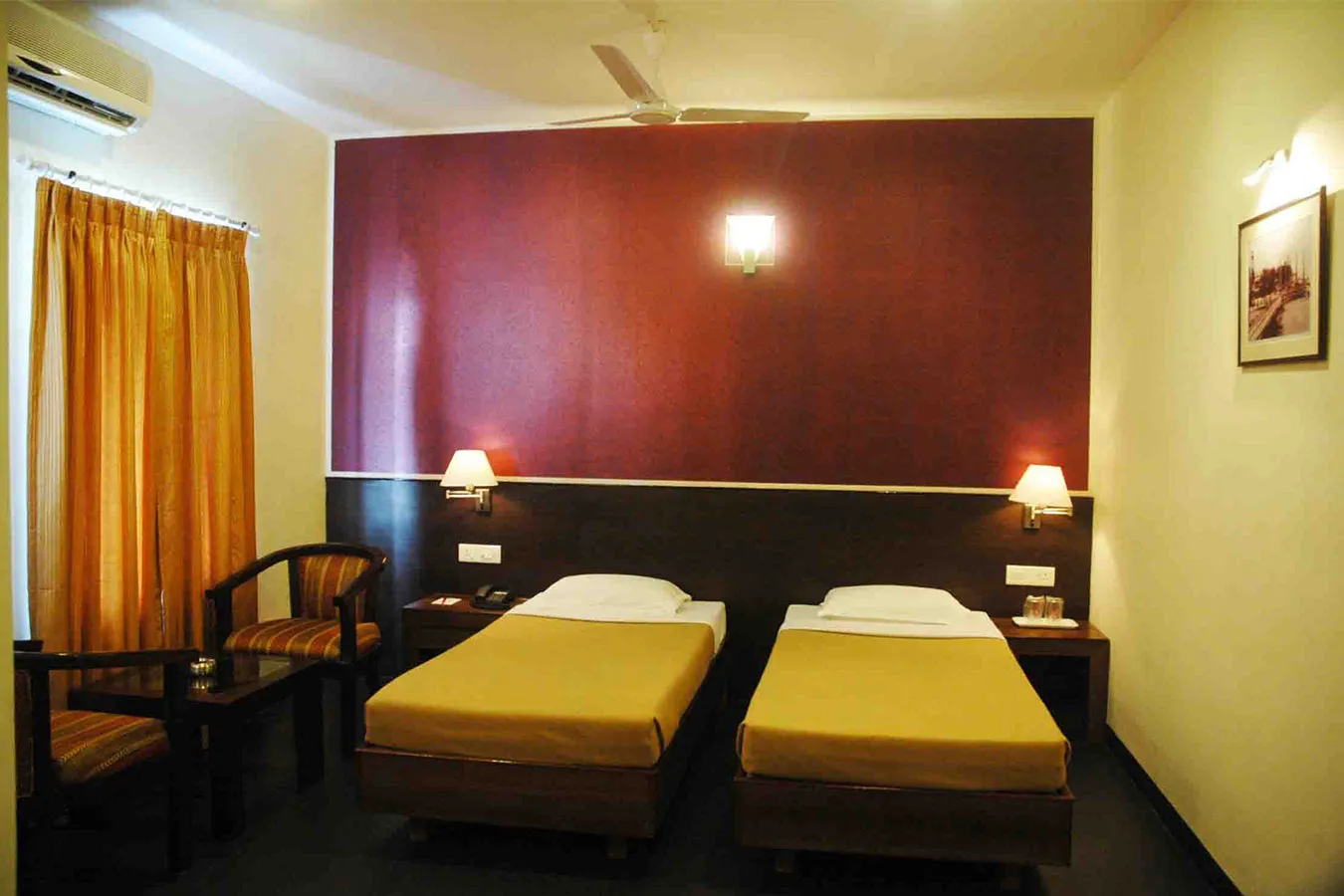 Twin Bed Hotel Room with Maroon Feature Wall