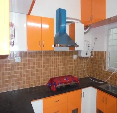 Vibrant Orange Modular Kitchen