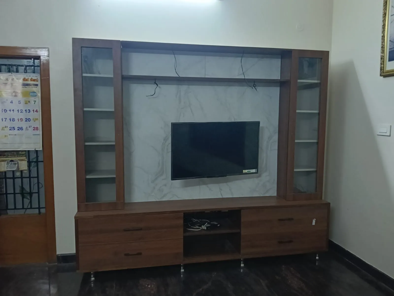 Modern  wallmounted wooden entertainment unit a marble finish panel and walnut Accents | TV Units Interior Design by Desk & Decor