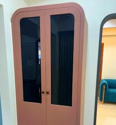 Bedroom with Curved-Top Terracotta Wardrobe
