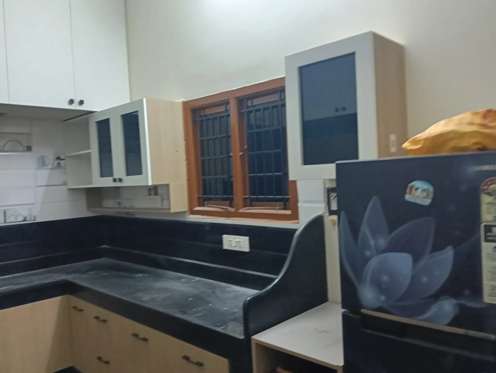 A Brown Aluminium window with Quartz Countertops Desk and Decor