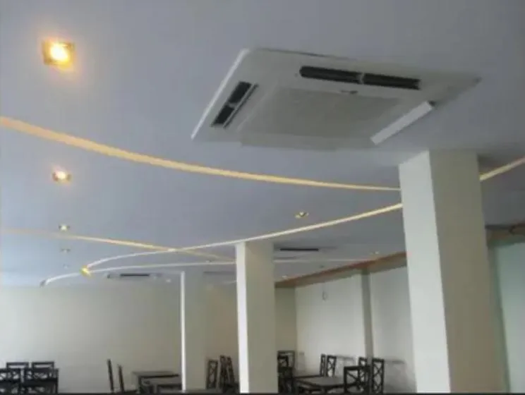 Commercial Restaurant Dining Hall with Wavy Ceiling Lights