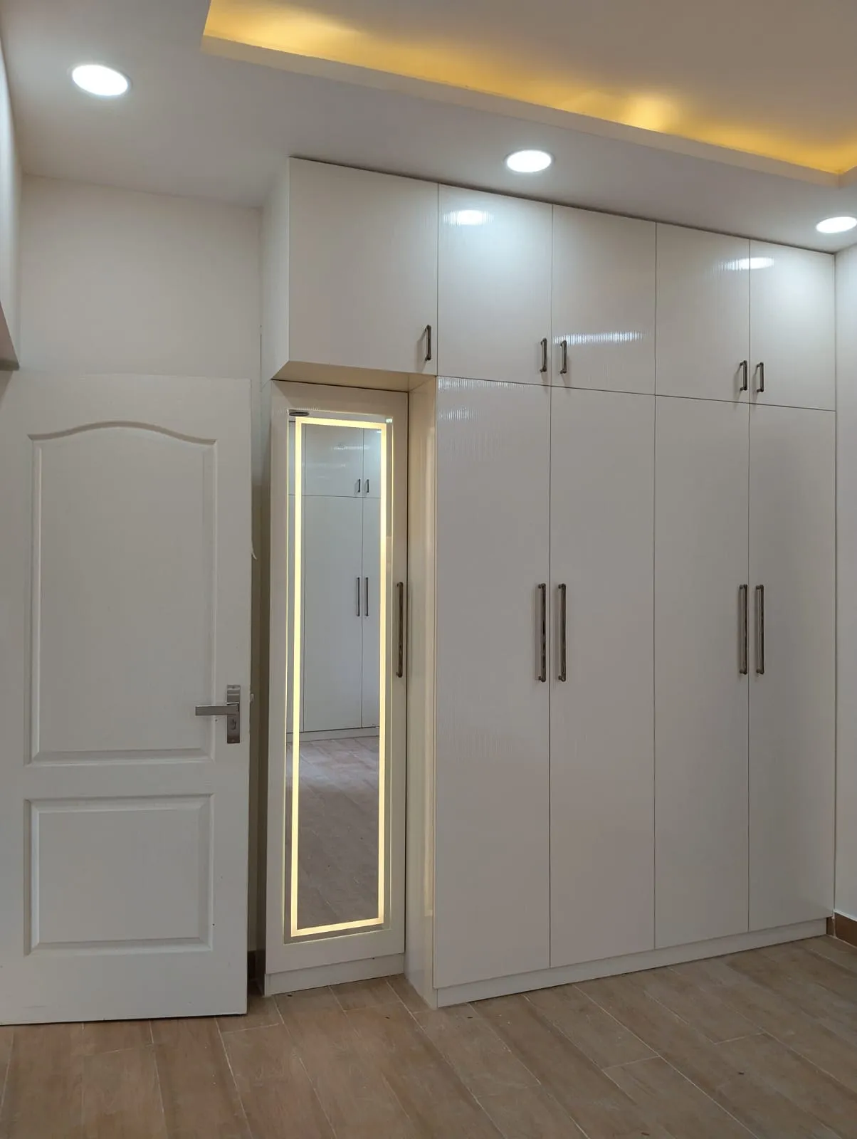 "Modern High-Gloss White Hinged Wardrobe with Integrated LED Dresser Mirror" | Wardrobes Interior Design by Desk & Decor